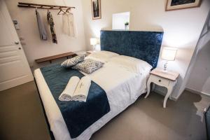 Postel nebo postele na pokoji v ubytování L'IMPERATORE Relax & Charme