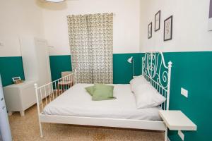 En eller flere senge i et værelse på La bicicletta Rossa B&B