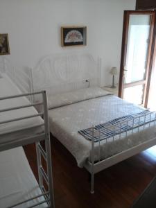 Postel nebo postele na pokoji v ubytování Casa Zia Adry