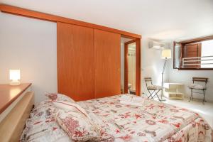 Postel nebo postele na pokoji v ubytování Lido Apartment