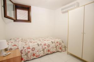 Postel nebo postele na pokoji v ubytování Lido Apartment