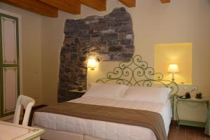 Ένα ή περισσότερα κρεβάτια σε δωμάτιο στο Hotel Borgo Antico