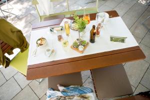 a table with bottles and drinks on it at Gasthof Garni Knupfer in Ehingen