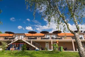 a building with umbrellas on top of it at Apartmani "ROSHU" in Soko Banja