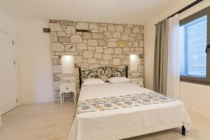 Postel nebo postele na pokoji v ubytování Bademli Konak Otel