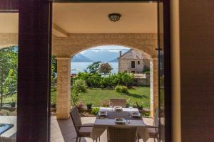 a view from a patio with a table and chairs at Apartments MarijaZ 2 in Kotor