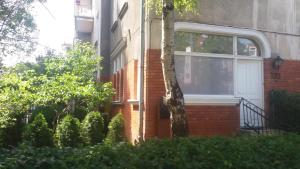 a brick house with a white door and a window at Baltic Sopot 732 in Sopot