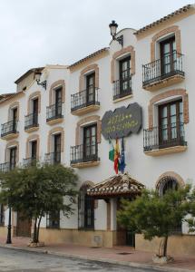 a large building with a sign on the side of it at Hotel Velad in Vélez Blanco