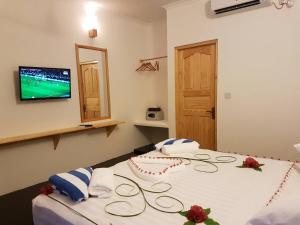 Postel nebo postele na pokoji v ubytování Thoddoo Beach Holiday