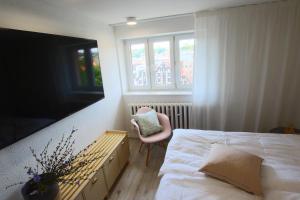 Posteľ alebo postele v izbe v ubytovaní Apartament Stary Port 1