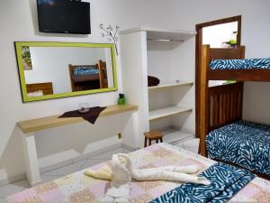 Bunk bed o mga bunk bed sa kuwarto sa RC Sol de Boiçucanga - Suite