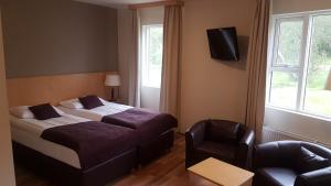 Postel nebo postele na pokoji v ubytování Hotel Hallormsstadur