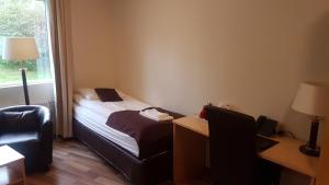 Postel nebo postele na pokoji v ubytování Hotel Hallormsstadur