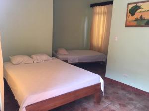 Postel nebo postele na pokoji v ubytování Cabinas Brisas del Golfo
