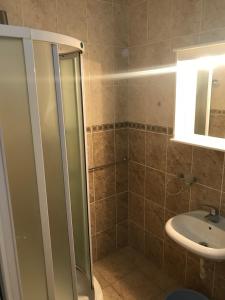 Koupelna v ubytování Apartmani Tomovic