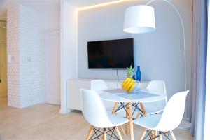Televízia a/alebo spoločenská miestnosť v ubytovaní Sea Cliff Apartment Rewal