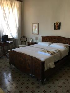 Posteľ alebo postele v izbe v ubytovaní Attico Luce B&B