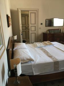 Posteľ alebo postele v izbe v ubytovaní Attico Luce B&B