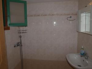 a bathroom with a sink and a mirror at Kokagia House in Cherronisos +16 photos