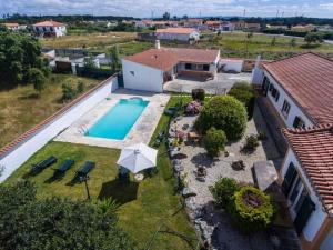 an aerial view of a house with a swimming pool at Quinta Sao Martinho in Reguengo Grande