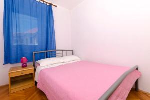 Postel nebo postele na pokoji v ubytování Apartments Katica