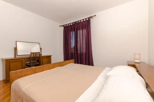 Postel nebo postele na pokoji v ubytování Apartments Katica