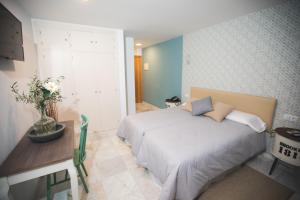 Кровать или кровати в номере Hotel Nómadas