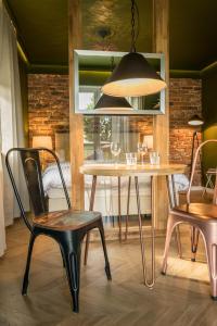 a dining room with a table and chairs at Uniejów Apartments in Uniejow