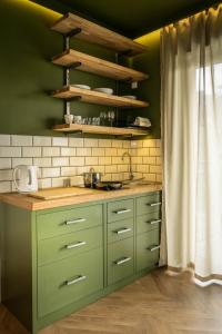 Kuchyňa alebo kuchynka v ubytovaní Uniejów Apartments