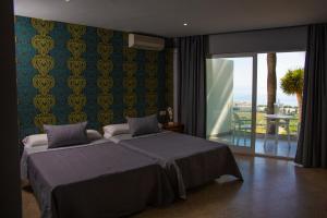 Postel nebo postele na pokoji v ubytování Hotel Salambina