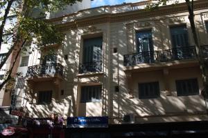 a building with balconies on the side of it at Hotel Ideal in Montevideo