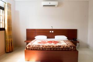 Postel nebo postele na pokoji v ubytování Hôtel Mirambeau
