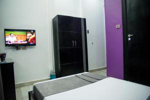 TV a/nebo společenská místnost v ubytování Egyptian Night Hostel