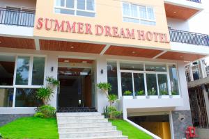 a hotel with a sign that reads summer dream hotel at Summer Dream Hotel in Phú Quốc