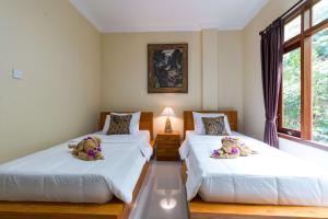 Voodi või voodid majutusasutuse Alam Pangkung Ubud toas