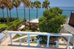 a view of the ocean from the balcony of a house at Limassol Beachfront Holiday Villa in Limassol