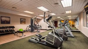 a gym with treadmills and elliptical machines at Best Western Plus Country Cupboard Inn in Lewisburg