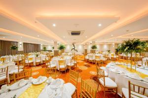 a banquet hall with white tables and chairs at Mandarina Colombo in Colombo +63 photos