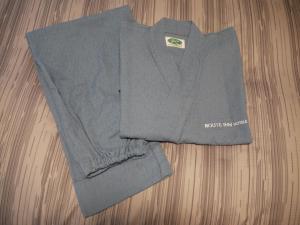 a grey sweater on top of a wooden table at Hotel Route-Inn Hakata Ekimae -Hakataguchi- in Fukuoka