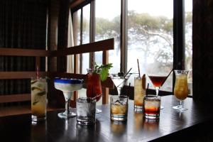 a group of different types of drinks on a table at Alpine Retreat Mt Buller in Mount Buller