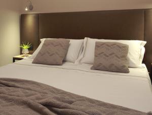Postel nebo postele na pokoji v ubytování Hotel Aloisi