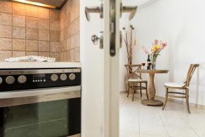 A kitchen or kitchenette at Panos Apartment Parikia