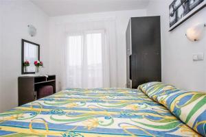 Postel nebo postele na pokoji v ubytování Apartments Macolic