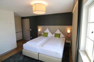 Postel nebo postele na pokoji v ubytování BA Hotel by WMM Hotels