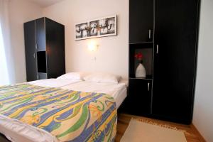Postel nebo postele na pokoji v ubytování Apartments Macolic