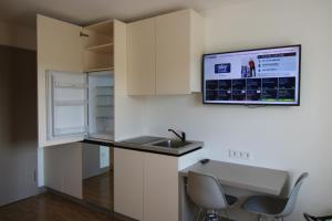 Kuchyň nebo kuchyňský kout v ubytování BA Hotel by WMM Hotels