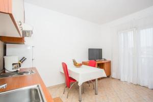 Kuchyň nebo kuchyňský kout v ubytování Apartments Macolic