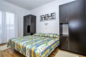 Postel nebo postele na pokoji v ubytování Apartments Macolic