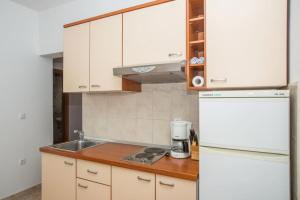 Kuchyň nebo kuchyňský kout v ubytování Apartments Macolic