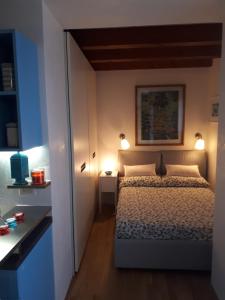 Mini Contrà San Pietro tesisinde bir odada yatak veya yataklar